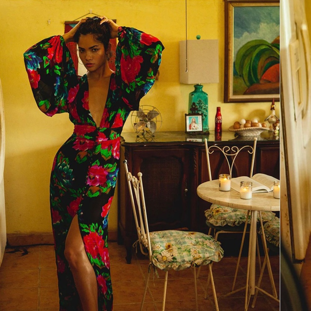 Cut in semi-sheer viscose, a sleek column silhouette and a plunging V-neck.